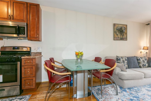 108-27 63rd Ave Unit 4B, Forest Hills, NY 11375 - dining area featuring wood finished floors and baseboards