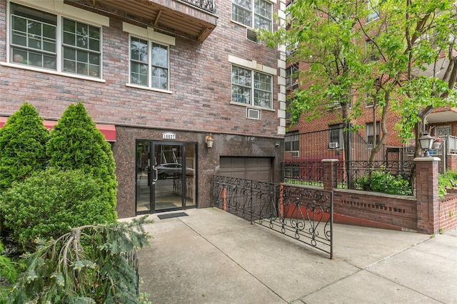 108-27 63rd Ave Unit 4B, Forest Hills, NY 11375 - doorway to property featuring fence and an attached garage