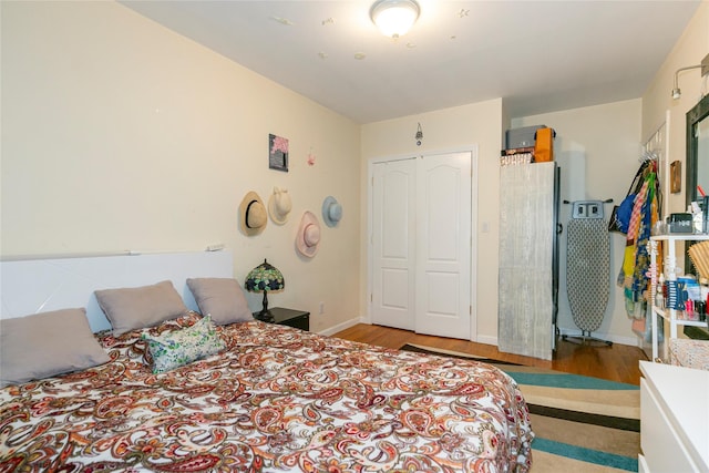 108-27 63rd Ave Unit 4B, Forest Hills, NY 11375 - bedroom featuring wood finished floors, a closet, and baseboards