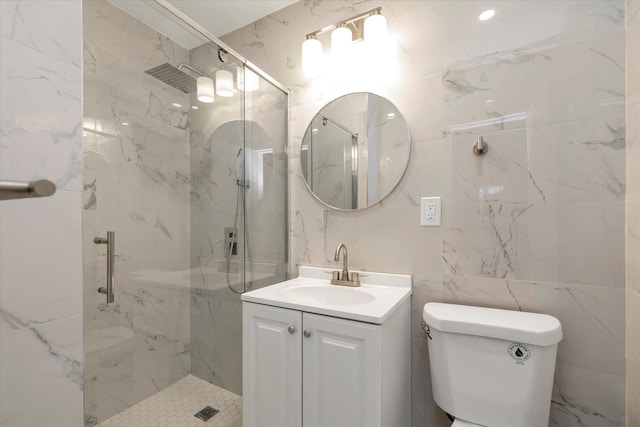 bathroom featuring vanity, a marble finish shower, toilet, and tile walls