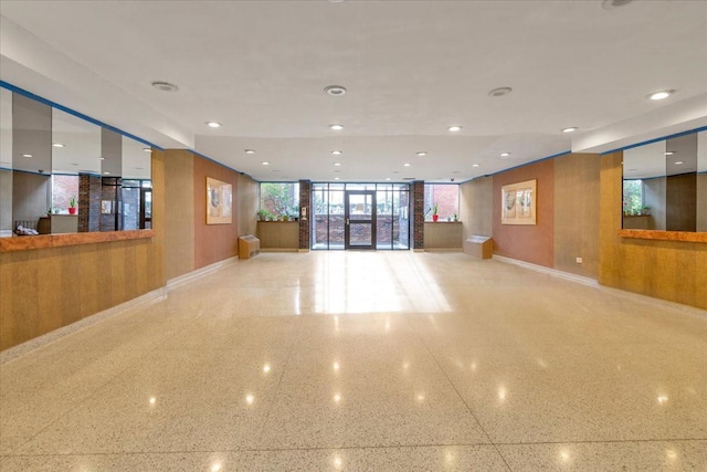 interior space with recessed lighting and baseboards