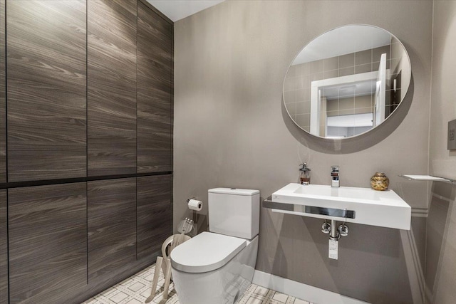 bathroom with tile patterned floors and toilet