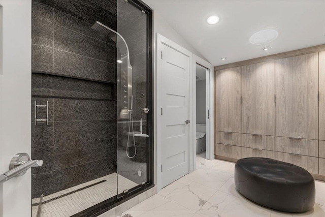 full bathroom featuring recessed lighting, marble finish floor, toilet, and a shower stall