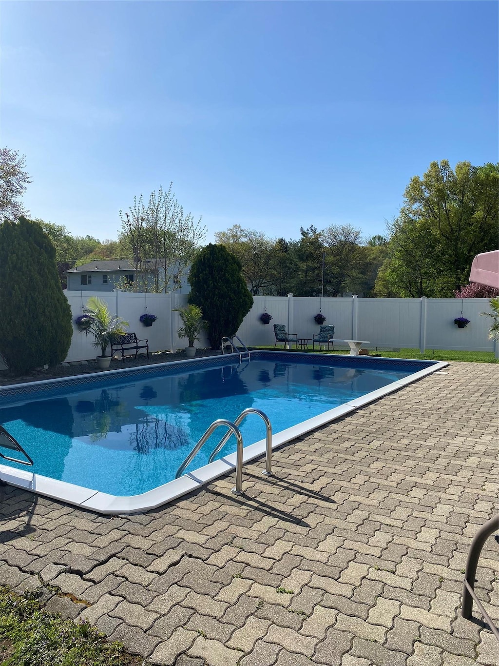 view of swimming pool with a fenced backyard, a fenced in pool, and a patio area