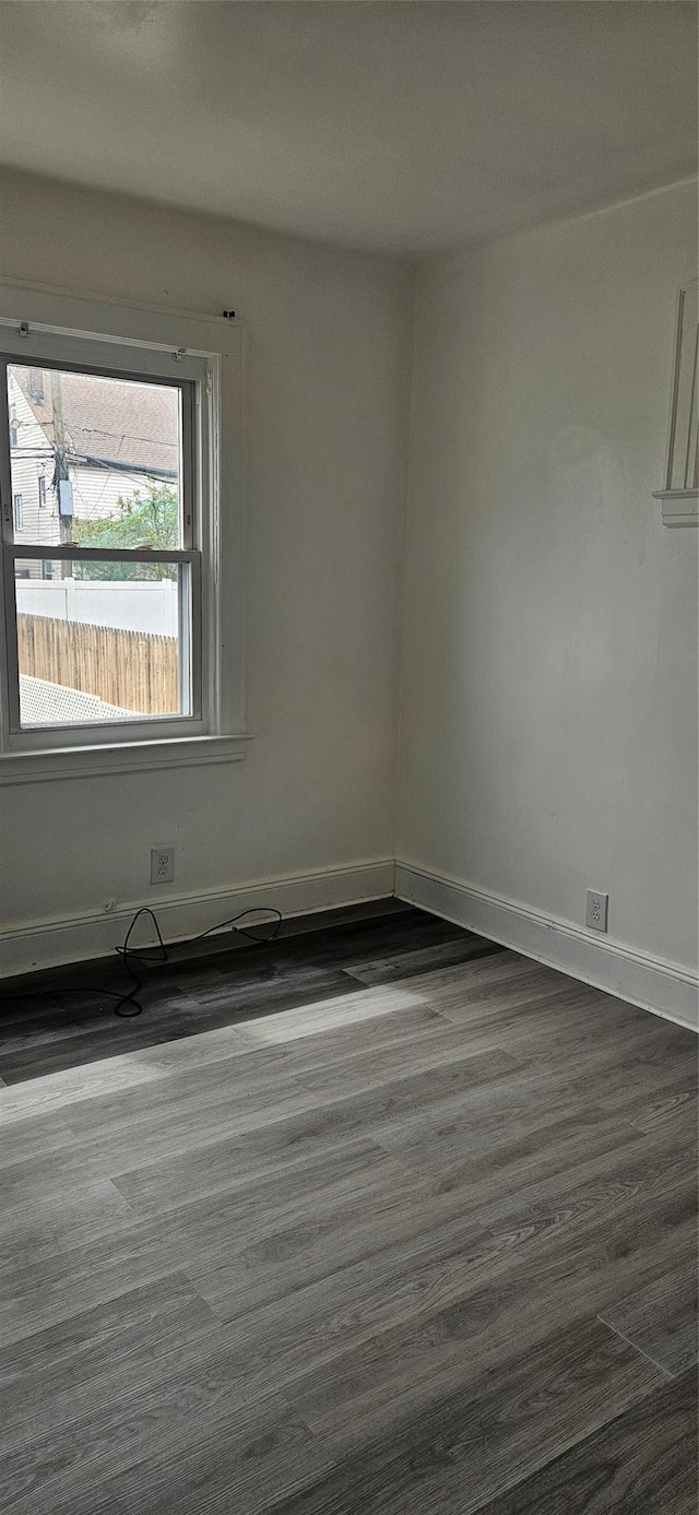 empty room featuring baseboards