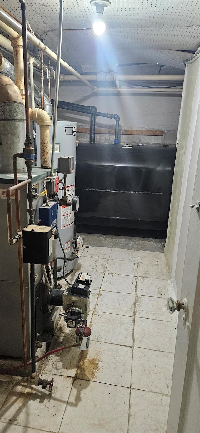 interior space featuring heating fuel and water heater