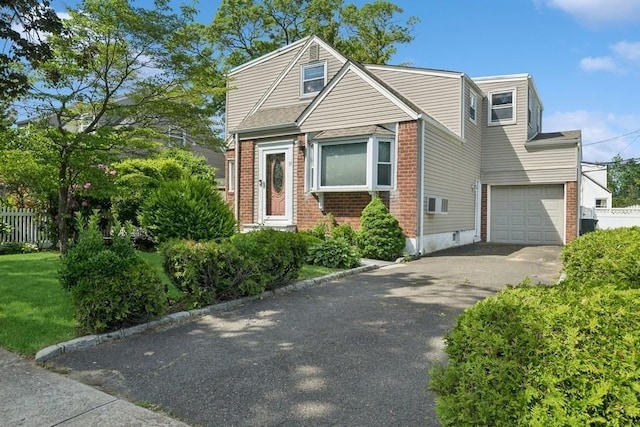 37 Remson St, Valley Stream, NY 11580 - view of front of home with asphalt driveway, brick siding, and an attached garage