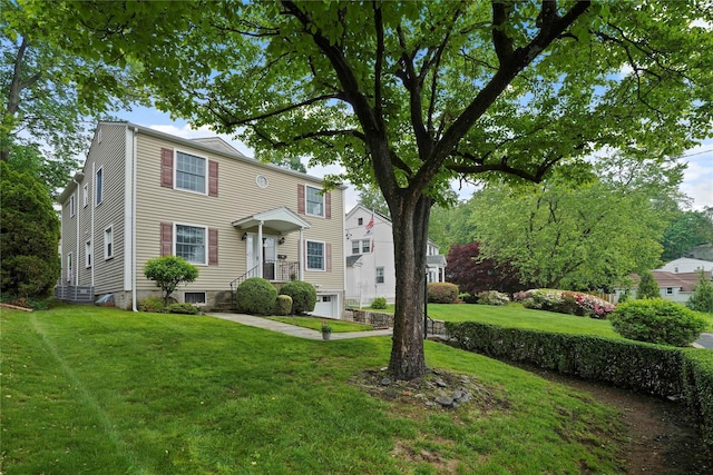 23 Hilldale Rd, Dobbs Ferry, NY 10522 - view of front of house featuring an attached garage and a front yard
