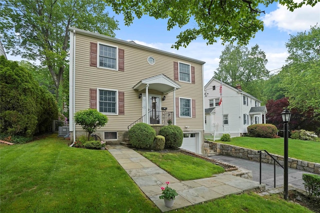 23 Hilldale Rd, Dobbs Ferry, NY 10522 - view of front of property with an attached garage, a front lawn, and driveway