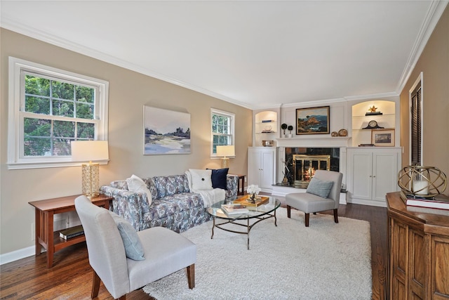 23 Hilldale Rd, Dobbs Ferry, NY 10522 - living area featuring wood finished floors, ornamental molding, a glass covered fireplace, baseboards, and built in features