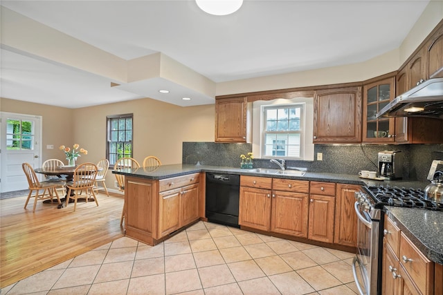 23 Hilldale Rd, Dobbs Ferry, NY 10522 - kitchen with dishwasher, stainless steel range with gas stovetop, a sink, a peninsula, and brown cabinets