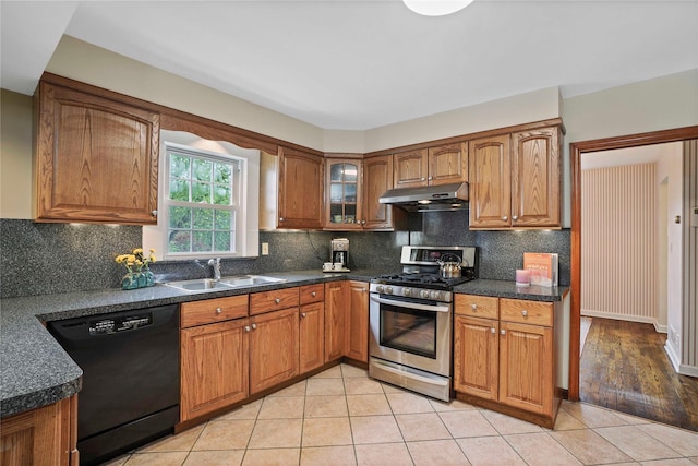 23 Hilldale Rd, Dobbs Ferry, NY 10522 - kitchen with dishwasher, stainless steel gas stove, a sink, under cabinet range hood, and brown cabinets
