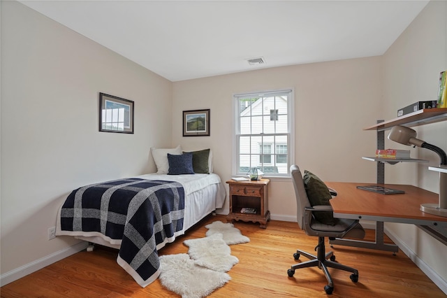 23 Hilldale Rd, Dobbs Ferry, NY 10522 - bedroom featuring wood finished floors, baseboards, and a desk