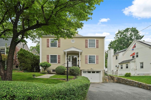 23 Hilldale Rd, Dobbs Ferry, NY 10522 - view of front facade with asphalt driveway and an attached garage