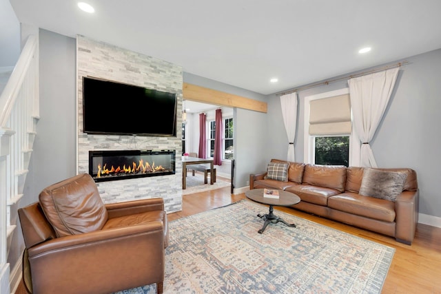 92 Ridgewood Ave, Yonkers, NY 10704 - living area with a stone fireplace, recessed lighting, light wood-style floors, and baseboards