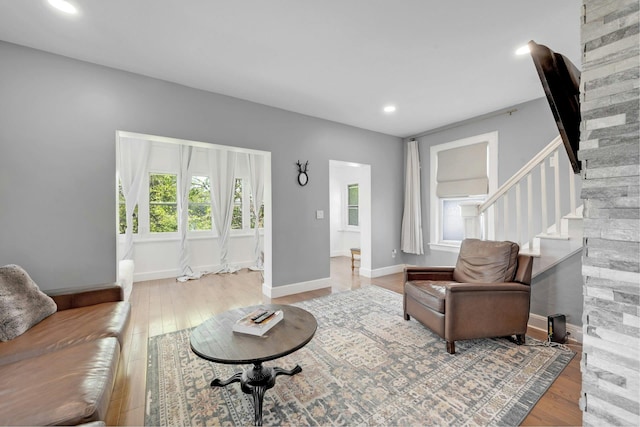 92 Ridgewood Ave, Yonkers, NY 10704 - living area featuring recessed lighting, baseboards, wood finished floors, and stairway