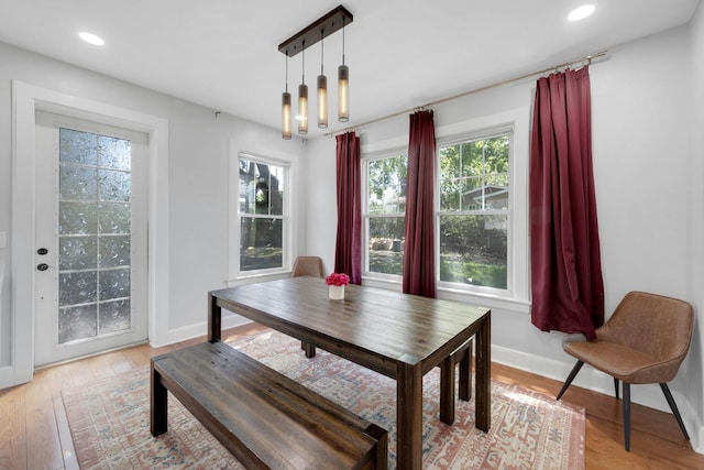 92 Ridgewood Ave, Yonkers, NY 10704 - dining space with baseboards, a healthy amount of sunlight, and light wood-type flooring