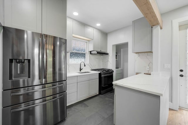 92 Ridgewood Ave, Yonkers, NY 10704 - kitchen featuring black gas range oven, stainless steel fridge, a sink, decorative backsplash, and beamed ceiling