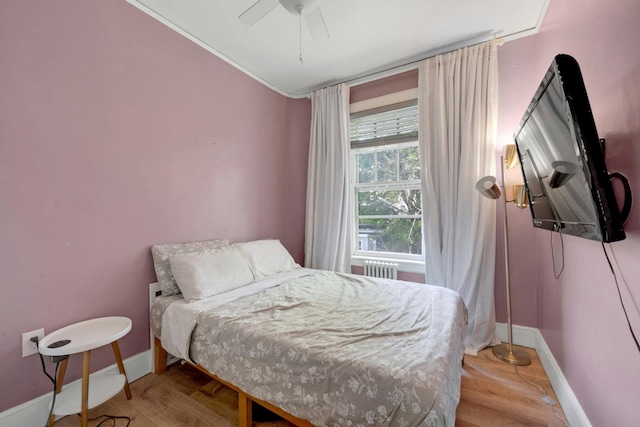 92 Ridgewood Ave, Yonkers, NY 10704 - bedroom featuring radiator, baseboards, and wood finished floors