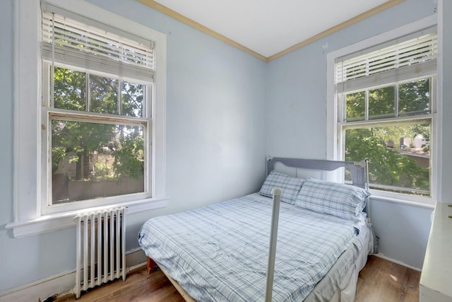 92 Ridgewood Ave, Yonkers, NY 10704 - bedroom with crown molding, radiator, and wood finished floors