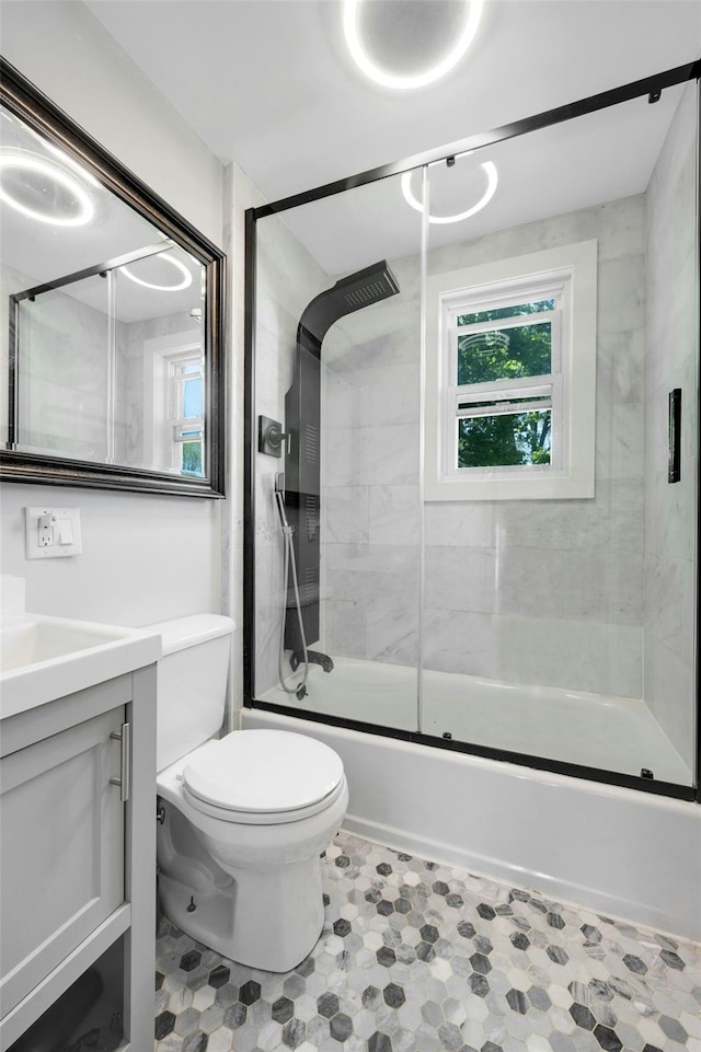 92 Ridgewood Ave, Yonkers, NY 10704 - full bathroom with vanity, enclosed tub / shower combo, a wealth of natural light, and toilet