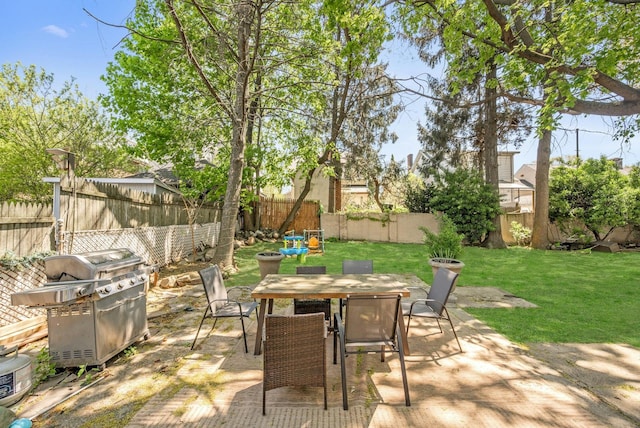 92 Ridgewood Ave, Yonkers, NY 10704 - view of patio with grilling area, outdoor dining space, and a fenced backyard