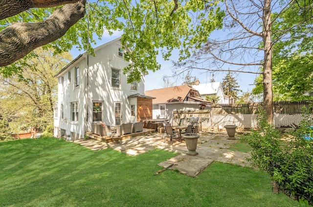 92 Ridgewood Ave, Yonkers, NY 10704 - rear view of house featuring fence, a lawn, and a patio area