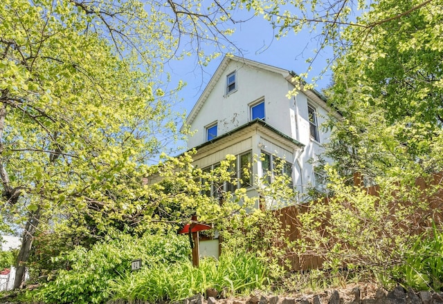 92 Ridgewood Ave, Yonkers, NY 10704 - view of property exterior featuring fence and stucco siding