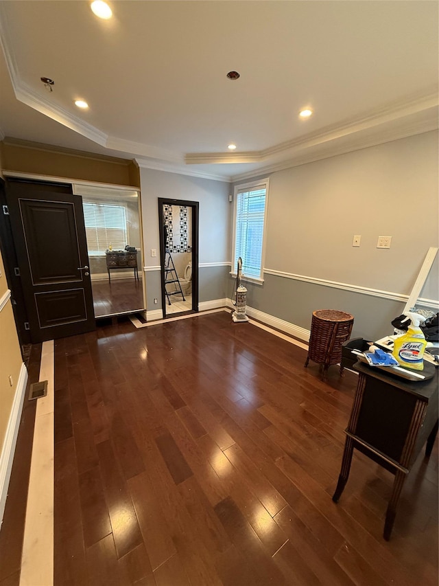 interior space featuring baseboards, recessed lighting, ornamental molding, and hardwood / wood-style flooring