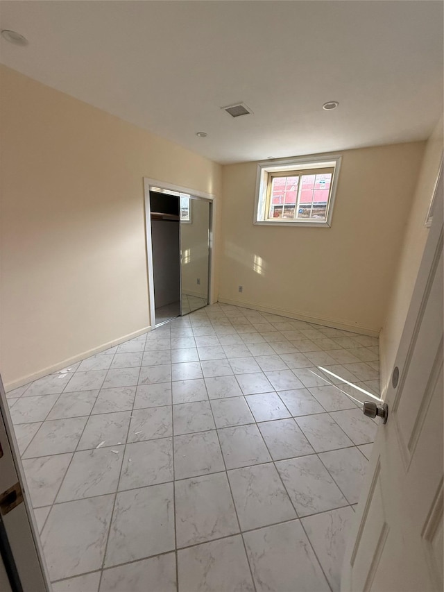 empty room with baseboards
