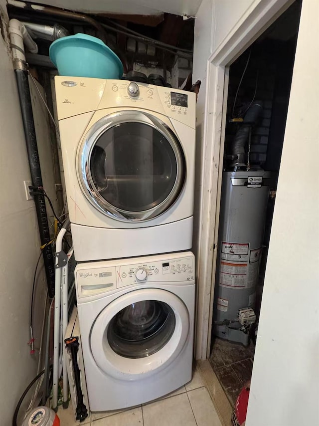 25-19 120th St, College Point, NY 11356 - laundry room featuring gas water heater, light tile patterned floors, stacked washing maching and dryer, and laundry area