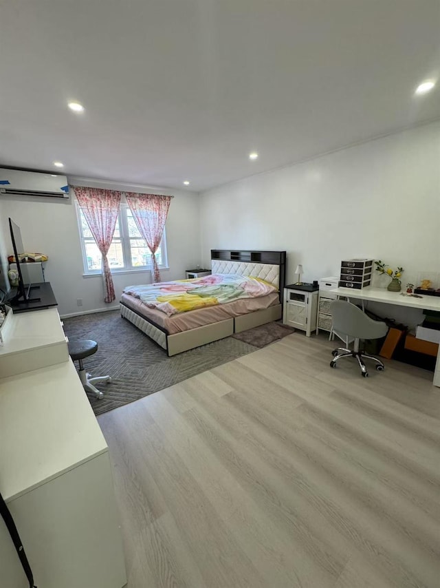 25-19 120th St, College Point, NY 11356 - bedroom featuring recessed lighting, a wall unit AC, and wood finished floors