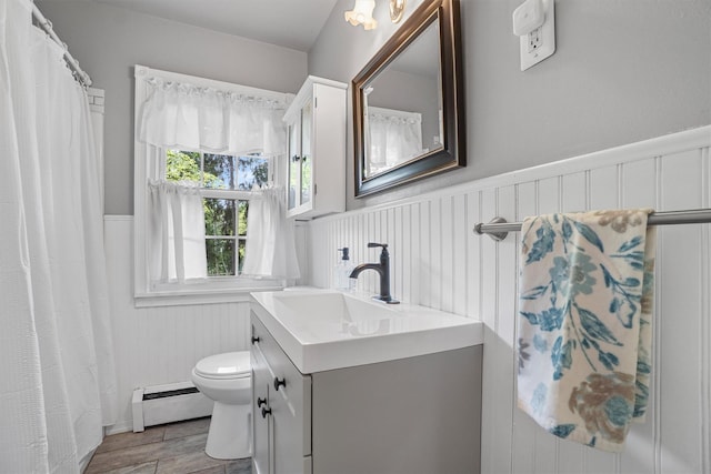 2 Jean Way, Purdys, NY 10578 - bathroom with baseboard heating, toilet, vanity, wainscoting, and wood finished floors