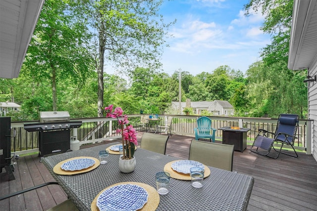 2 Jean Way, Purdys, NY 10578 - wooden terrace with outdoor dining space, grilling area, an outdoor fire pit, and view of scattered trees