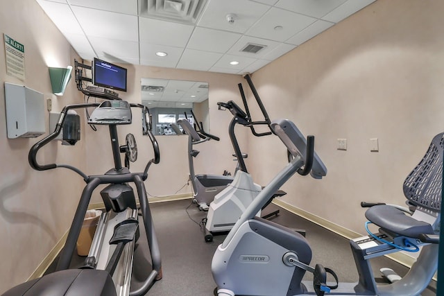 gym with a drop ceiling, visible vents, and recessed lighting