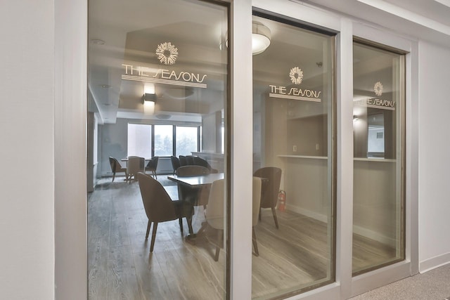 dining room featuring baseboards and wood finished floors