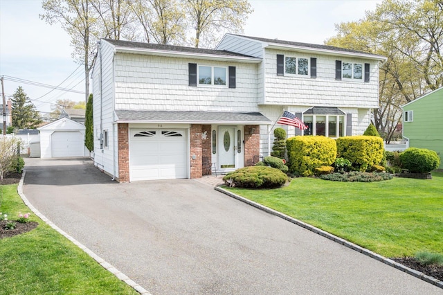 view of front of house featuring brick siding, driveway, and a front yard