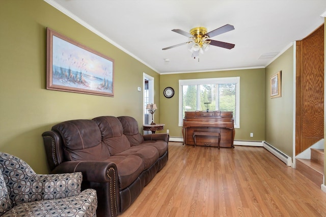 living area with a ceiling fan, crown molding, light wood-type flooring, baseboards, and a baseboard radiator
