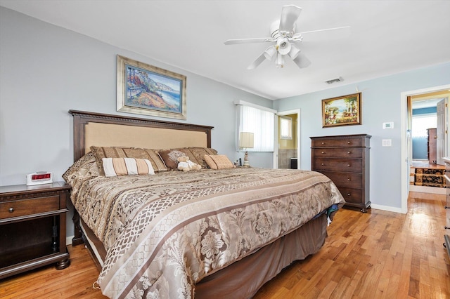 bedroom featuring visible vents, a ceiling fan, light wood finished floors, and multiple windows