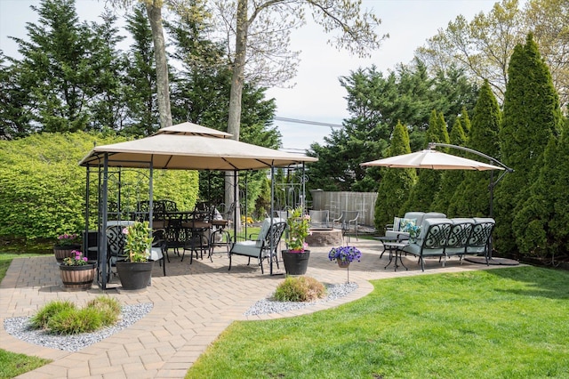 exterior space with a gazebo and an outdoor hangout area