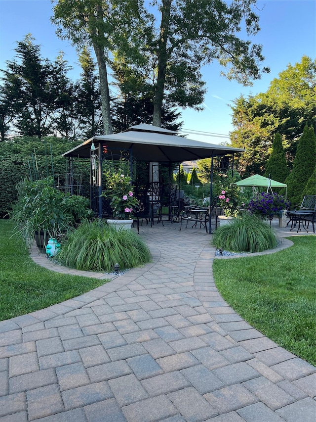 view of property's community featuring a gazebo and a patio