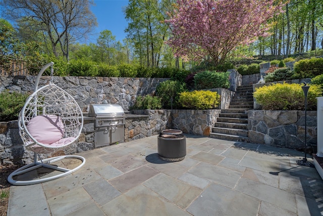 view of patio / terrace with stairs, grilling area, and area for grilling