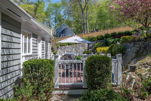 exterior space with a fenced backyard and outdoor dining area