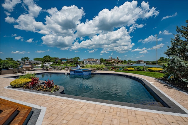 136 The Helm, East Islip, NY 11730 - view of swimming pool with a pool with connected hot tub and a water view