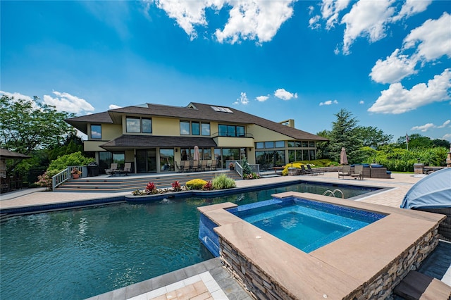 136 The Helm, East Islip, NY 11730 - swimming pool featuring an in-ground hot tub and a patio area