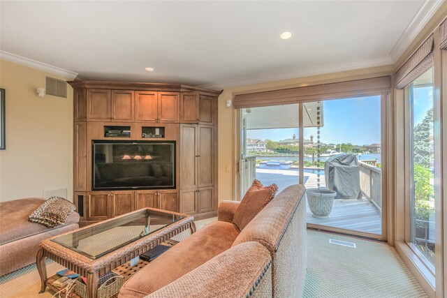 136 The Helm, East Islip, NY 11730 - living area with ornamental molding, recessed lighting, and light colored carpet
