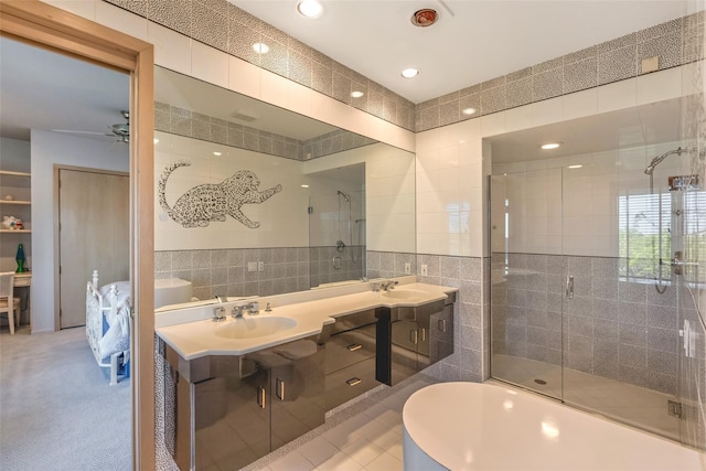 136 The Helm, East Islip, NY 11730 - bathroom with tile walls, a shower stall, double vanity, a bath, and recessed lighting