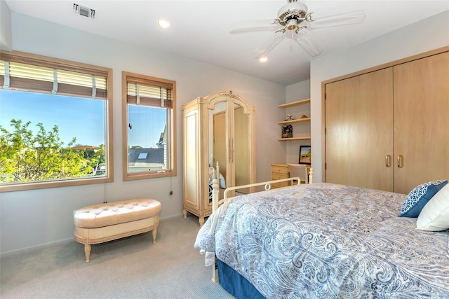 136 The Helm, East Islip, NY 11730 - bedroom featuring light carpet, a closet, recessed lighting, and a ceiling fan