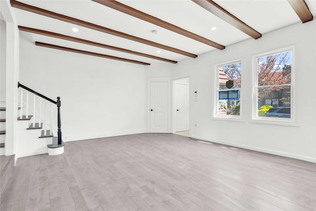 179-55 Anderson Rd, Jamaica, NY 11434 - unfurnished living room featuring beamed ceiling, baseboards, recessed lighting, wood finished floors, and stairs