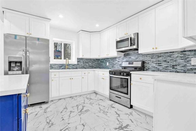 179-55 Anderson Rd, Jamaica, NY 11434 - kitchen with appliances with stainless steel finishes, light countertops, marble finish floor, white cabinets, and backsplash